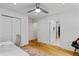 Second bedroom with a ceiling fan, hardwood floors, and a closet perfect for storage at 1377 Oak Grove Dr, Decatur, GA 30033