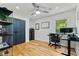 A bedroom with hardwood floors, ample storage, and a work space bathed in natural light at 1377 Oak Grove Dr, Decatur, GA 30033