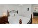Comfortable bedroom with a wrought iron bed frame, wood floors, and ensuite bath access at 1377 Oak Grove Dr, Decatur, GA 30033