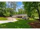 Well-maintained single-story home with a manicured front lawn and patterned driveway, offering curb appeal at 1377 Oak Grove Dr, Decatur, GA 30033