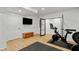 Spacious home gym featuring exercise equipment, recessed lighting, and bright white paint at 1377 Oak Grove Dr, Decatur, GA 30033