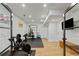Home gym featuring exercise equipment, glass doors, recessed lighting, and a rubber floor at 1377 Oak Grove Dr, Decatur, GA 30033