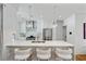 Modern kitchen with white cabinets and bar stool seating at a countertop at 1377 Oak Grove Dr, Decatur, GA 30033