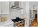 A kitchen with stainless steel appliances and adjacent walk-in pantry at 1377 Oak Grove Dr, Decatur, GA 30033