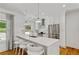 Modern kitchen featuring stainless steel appliances, a breakfast bar with seating and ample counter space at 1377 Oak Grove Dr, Decatur, GA 30033