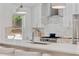 The kitchen features a stainless steel faucet, stainless steel appliances, and pendant lighting at 1377 Oak Grove Dr, Decatur, GA 30033