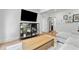 Bright living room with a sectional sofa, modern furniture, and decoratively displayed houseplants at 1377 Oak Grove Dr, Decatur, GA 30033