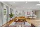 Bright living room featuring hardwood floors, a modern kitchen, and stylish furniture at 1377 Oak Grove Dr, Decatur, GA 30033
