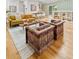 Open-concept living space with hardwood floors, seamlessly connecting the living room and kitchen at 1377 Oak Grove Dr, Decatur, GA 30033