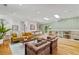 Bright living room featuring hardwood floors, stylish furnishings, and built-in shelving at 1377 Oak Grove Dr, Decatur, GA 30033