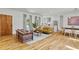 Open-concept living space with hardwood floors, seamlessly connecting the living room and kitchen at 1377 Oak Grove Dr, Decatur, GA 30033