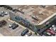 Aerial view of Oak Grove Market, featuring colorful mural, parking lot, and surrounding businesses at 1377 Oak Grove Dr, Decatur, GA 30033
