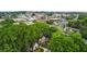 High angle aerial view of 194 Locust with surrounding greenery and a charming town in the backdrop at 194 Locust Nw St, Marietta, GA 30064