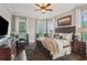Relaxing bedroom featuring hardwood floors, natural light, and comfortable furnishings at 194 Locust Nw St, Marietta, GA 30064