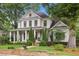 Charming two-story home with manicured lawn, brick accents and inviting front porch at 194 Locust Nw St, Marietta, GA 30064