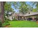 Charming home with a spacious lawn, a covered parking area, and a well-maintained garden at 194 Locust Nw St, Marietta, GA 30064