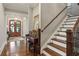 Home foyer featuring hardwood floors, stairs to the second floor and a piano at 194 Locust Nw St, Marietta, GA 30064