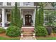 Inviting front porch with detailed trim work and lush landscaping at 194 Locust Nw St, Marietta, GA 30064