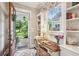 Bright home office with built-in bookshelves, window view, and desk—perfect for working from home at 194 Locust Nw St, Marietta, GA 30064