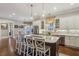Bright kitchen with marble countertops, an island with seating, and stainless steel appliances at 194 Locust Nw St, Marietta, GA 30064