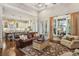 Bright and open living room with hardwood floors, fireplace and seamless flow to the kitchen at 194 Locust Nw St, Marietta, GA 30064