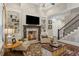 Inviting living room with fireplace, staircase and built-in bookshelves at 194 Locust Nw St, Marietta, GA 30064