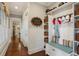 Hallway showing hooks for coats, storage, and a sitting bench at 194 Locust Nw St, Marietta, GA 30064