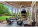Screened-in porch with outdoor seating, a fireplace, and a view of the backyard at 194 Locust Nw St, Marietta, GA 30064