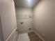 Practical laundry room features a shelf and utility connections at 20 Emerald Ln, Covington, GA 30014