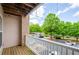Balcony view overlooking the parking lot with gazebo, landscaping, and blue skies at 1955 Nocturne Dr # 3206, Alpharetta, GA 30009