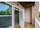 View into unit from balcony featuring wood flooring, siding, and white trim at 1955 Nocturne Dr # 3206, Alpharetta, GA 30009