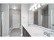 Bathroom features a double vanity and shower-tub combo at 1955 Nocturne Dr # 3206, Alpharetta, GA 30009