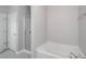 The bathroom features a shower and separate bathtub at 1955 Nocturne Dr # 3206, Alpharetta, GA 30009