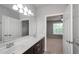 Bathroom featuring a double vanity and view into bedroom at 1955 Nocturne Dr # 3206, Alpharetta, GA 30009