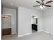 This bedroom has a ceiling fan and adjoining bathroom at 1955 Nocturne Dr # 3206, Alpharetta, GA 30009