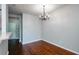 Dining area featuring hardwood floors and contemporary chandelier at 1955 Nocturne Dr # 3206, Alpharetta, GA 30009