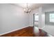 Dining area with hardwood floors and a view into the next room at 1955 Nocturne Dr # 3206, Alpharetta, GA 30009