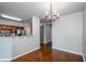 Open dining area featuring wood floors and modern lighting at 1955 Nocturne Dr # 3206, Alpharetta, GA 30009