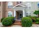 Well-maintained building entrance with manicured landscaping at 1955 Nocturne Dr # 3206, Alpharetta, GA 30009