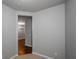 Neutral-colored hallway leading to a room with a chandelier at 1955 Nocturne Dr # 3206, Alpharetta, GA 30009
