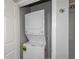 A stacked washer and dryer in the laundry area at 1955 Nocturne Dr # 3206, Alpharetta, GA 30009