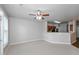 Living room with windows and an open bar area that leads to the kitchen at 1955 Nocturne Dr # 3206, Alpharetta, GA 30009