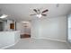 Spacious living room features an adjacent dining room with a chandelier at 1955 Nocturne Dr # 3206, Alpharetta, GA 30009