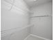 A well-organized walk-in closet with wire shelving at 1955 Nocturne Dr # 3206, Alpharetta, GA 30009