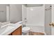 Standard bathroom featuring a shower over tub, a vanity with a sink, and neutral decor at 3514 Willgrove Way, Duluth, GA 30096