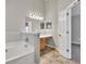 Spacious bathroom featuring a tub, generous counter space, and good lighting at 3514 Willgrove Way, Duluth, GA 30096