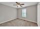 Bedroom features ceiling fan, natural light, and neutral walls at 3514 Willgrove Way, Duluth, GA 30096