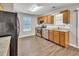 Well-lit kitchen features stainless steel appliances and light wood cabinets at 3514 Willgrove Way, Duluth, GA 30096