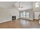 Spacious living room with wood floors, a fireplace, and a large window for ample natural light at 3514 Willgrove Way, Duluth, GA 30096