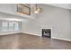 Spacious living room with wood floors, a fireplace, and a large window for ample natural light at 3514 Willgrove Way, Duluth, GA 30096